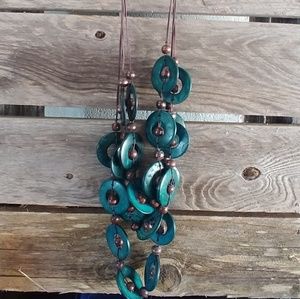 Teal colored circle design necklace